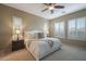 Main bedroom with plush carpet, ceiling fan, and plenty of natural light at 2026 N Atwood --, Mesa, AZ 85207