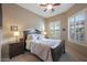 Well-lit bedroom with dark wood furniture and plantation shutters at 2026 N Atwood --, Mesa, AZ 85207