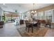 Bright dining room with hardwood floors and access to the living room and patio at 2026 N Atwood --, Mesa, AZ 85207