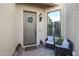 Inviting front entrance with two wicker chairs and potted plants at 2026 N Atwood --, Mesa, AZ 85207