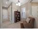 Hallway with a bookcase and comfortable armchair at 2026 N Atwood --, Mesa, AZ 85207