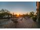 Evening view of patio with tables and chairs at 2026 N Atwood --, Mesa, AZ 85207