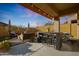Covered patio with outdoor kitchen and seating area, perfect for entertaining at 2026 N Atwood --, Mesa, AZ 85207
