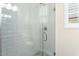 Clean and spacious walk-in shower with gray tile and glass enclosure at 20584 W Pasadena Ave, Litchfield Park, AZ 85340