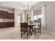 Bright dining area with a table and chairs, adjacent to kitchen at 20975 E Camina Buena Vista Ct, Queen Creek, AZ 85142