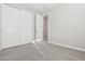 Bedroom with double door closet and carpeted floor at 21004 N 58Th Way, Phoenix, AZ 85054