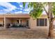 Backyard view of patio, landscaping, and home at 2101 S Yellow Wood -- # 75, Mesa, AZ 85209