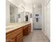Bathroom with double sinks, wood cabinets, and a separate shower at 2101 S Yellow Wood -- # 75, Mesa, AZ 85209