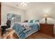 Bright bedroom with hardwood floors and a ceiling fan at 2101 S Yellow Wood -- # 75, Mesa, AZ 85209