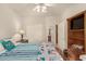 Bedroom with hardwood floors and built-in shelving at 2101 S Yellow Wood -- # 75, Mesa, AZ 85209