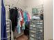 Large walk-in closet with shelving and hanging rods at 2101 S Yellow Wood -- # 75, Mesa, AZ 85209