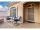 Small front porch with table and chairs at 2101 S Yellow Wood -- # 75, Mesa, AZ 85209