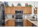 Kitchen with stainless steel appliances and a tile backsplash at 2101 S Yellow Wood -- # 75, Mesa, AZ 85209
