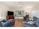 Living room with hardwood floors and comfy furniture at 2101 S Yellow Wood -- # 75, Mesa, AZ 85209