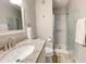 Updated bathroom with granite vanity, shower, and white fixtures at 2228 E Campbell Ave # 121, Phoenix, AZ 85016