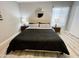 Spacious bedroom with king bed and wood-look flooring at 2228 E Campbell Ave # 121, Phoenix, AZ 85016