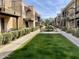 Community courtyard with lush landscaping and a central fountain at 2228 E Campbell Ave # 121, Phoenix, AZ 85016