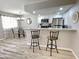 Updated kitchen featuring granite counters and breakfast bar at 2228 E Campbell Ave # 121, Phoenix, AZ 85016