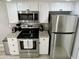 Modern kitchen with stainless steel appliances and granite countertops at 2228 E Campbell Ave # 121, Phoenix, AZ 85016
