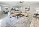 Bright living room with sectional sofa, coffee table, and wood-look floors at 2228 E Campbell Ave # 121, Phoenix, AZ 85016