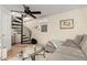 Cozy living room features a spiral staircase and comfortable seating at 2515 N 10Th St, Phoenix, AZ 85006