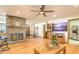 Living room with hardwood floors, fireplace and ceiling fan at 2930 W Belmont Ave, Phoenix, AZ 85051