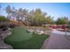 Landscaped backyard oasis with putting green and pool at 29991 N 78Th Pl, Scottsdale, AZ 85266