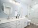 Bathroom with double vanity, large shower, and marble tile at 29991 N 78Th Pl, Scottsdale, AZ 85266