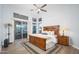 Spacious bedroom with wood furniture and access to backyard at 29991 N 78Th Pl, Scottsdale, AZ 85266