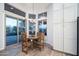 Charming breakfast nook with a round table and sliding glass doors to patio at 29991 N 78Th Pl, Scottsdale, AZ 85266