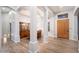 Light and airy entryway with hardwood floors and columns at 29991 N 78Th Pl, Scottsdale, AZ 85266