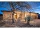 Desert landscaping surrounds this single-story home with a large garage at 29991 N 78Th Pl, Scottsdale, AZ 85266