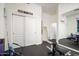 Home gym with weight bench, mirror, and plenty of storage at 29991 N 78Th Pl, Scottsdale, AZ 85266