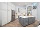 Modern kitchen with white cabinets, stainless steel appliances, and an island at 29991 N 78Th Pl, Scottsdale, AZ 85266