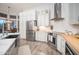 Updated kitchen features butcher block countertops and stainless steel appliances at 29991 N 78Th Pl, Scottsdale, AZ 85266