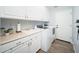 Laundry room with washer, dryer, cabinets, and utility sink at 29991 N 78Th Pl, Scottsdale, AZ 85266