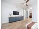 Bright living room features hardwood floors, a cozy fireplace, and large windows at 29991 N 78Th Pl, Scottsdale, AZ 85266