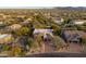 Aerial view of home and surrounding neighborhood, mountain views in background at 29991 N 78Th Pl, Scottsdale, AZ 85266