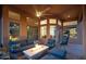 Relaxing covered patio with fire pit and comfortable seating at 29991 N 78Th Pl, Scottsdale, AZ 85266