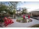 Inviting kidney shaped pool with surrounding patio and chairs at 29991 N 78Th Pl, Scottsdale, AZ 85266
