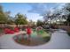 Relaxing kidney shaped pool with red chairs and patio at 29991 N 78Th Pl, Scottsdale, AZ 85266