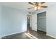 Bedroom with wood-look floors and ceiling fan at 3433 E Paradise Dr, Phoenix, AZ 85028