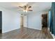 Light and airy bedroom with dark gray wood flooring at 3433 E Paradise Dr, Phoenix, AZ 85028