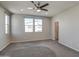 Well-lit bedroom featuring two windows and a closet at 371 N 157Th Ln, Goodyear, AZ 85338