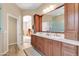 Elegant bathroom with double vanity and a large mirror at 3839 E Peach Tree E Dr, Chandler, AZ 85249