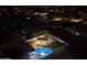 Nighttime aerial view of a house with a pool and backyard at 4530 W Misty Willow Ln, Glendale, AZ 85310