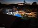 Night view of house, pool, and backyard at 4530 W Misty Willow Ln, Glendale, AZ 85310