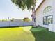 Putting green and grassy backyard at 4530 W Misty Willow Ln, Glendale, AZ 85310