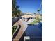 Pergola with built-in BBQ and seating area overlooking the pool at 4530 W Misty Willow Ln, Glendale, AZ 85310