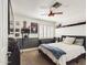 Bright bedroom with a queen bed and ceiling fan at 4530 W Misty Willow Ln, Glendale, AZ 85310